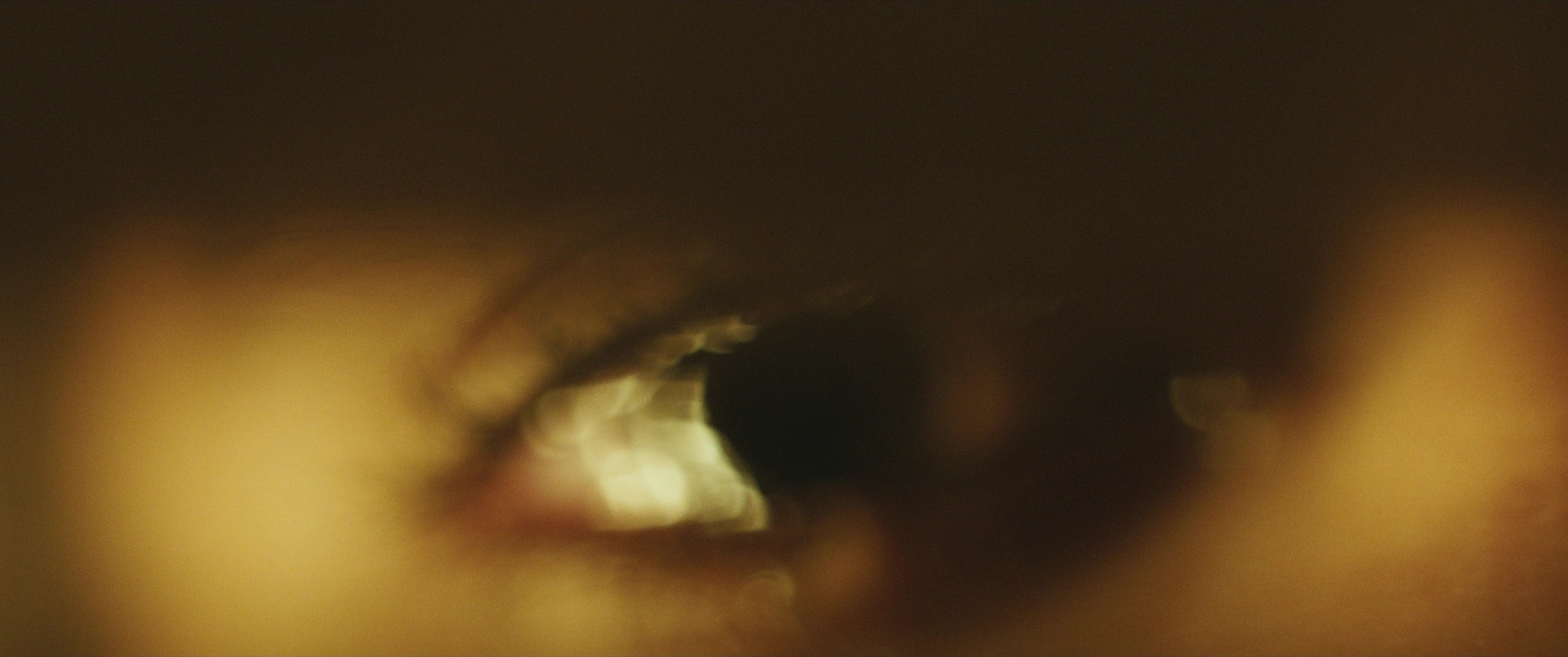 Close-up cinematic still of an eye, documentary film